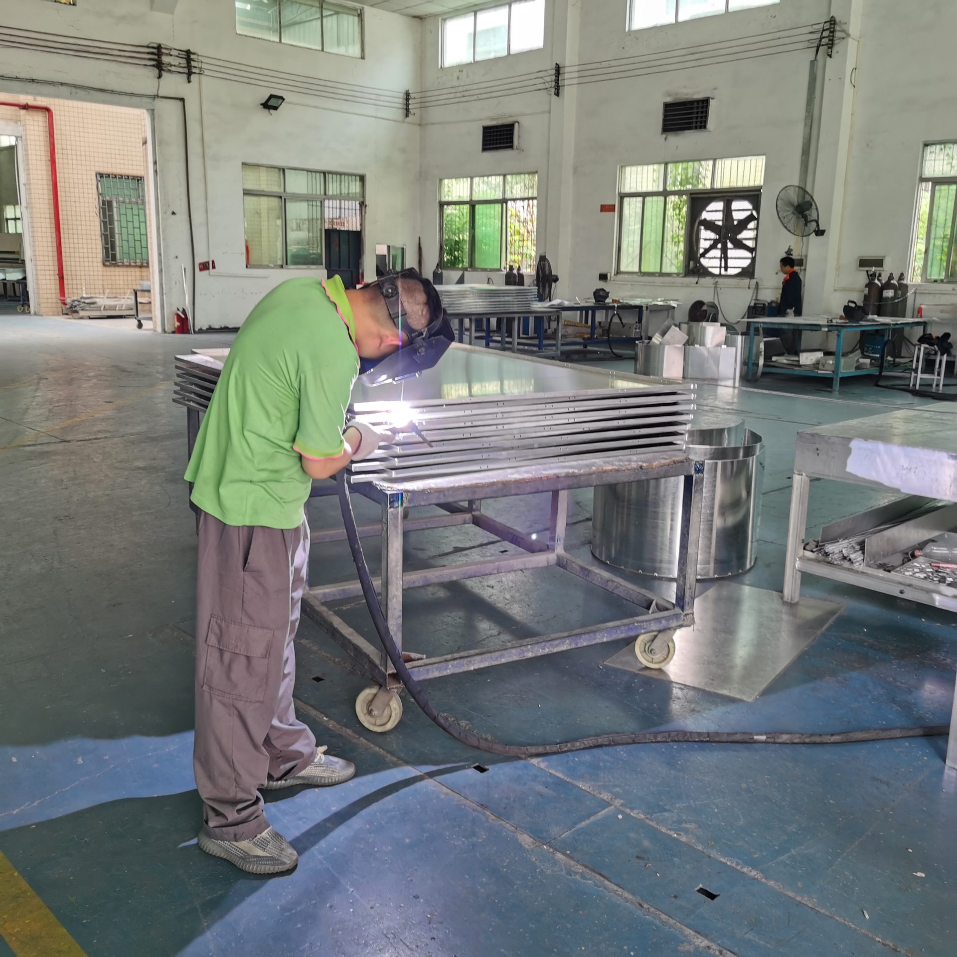 Aluminum Veneer Panel Installation: Complete Guide for Facade Contractors TIG welding aluminum veneer panel corner reinforcement at Likton factory