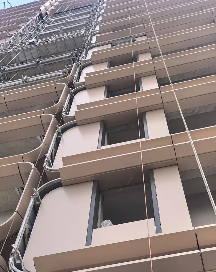 Is Metal Cladding Safe for Typhoon Areas? What Buyers Should Check Before Ordering High-rise metal cladding installation showing facade panels, joints, and supporting construction