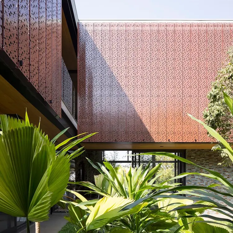 Likton copper color perforated aluminum facade panels on a building exterior