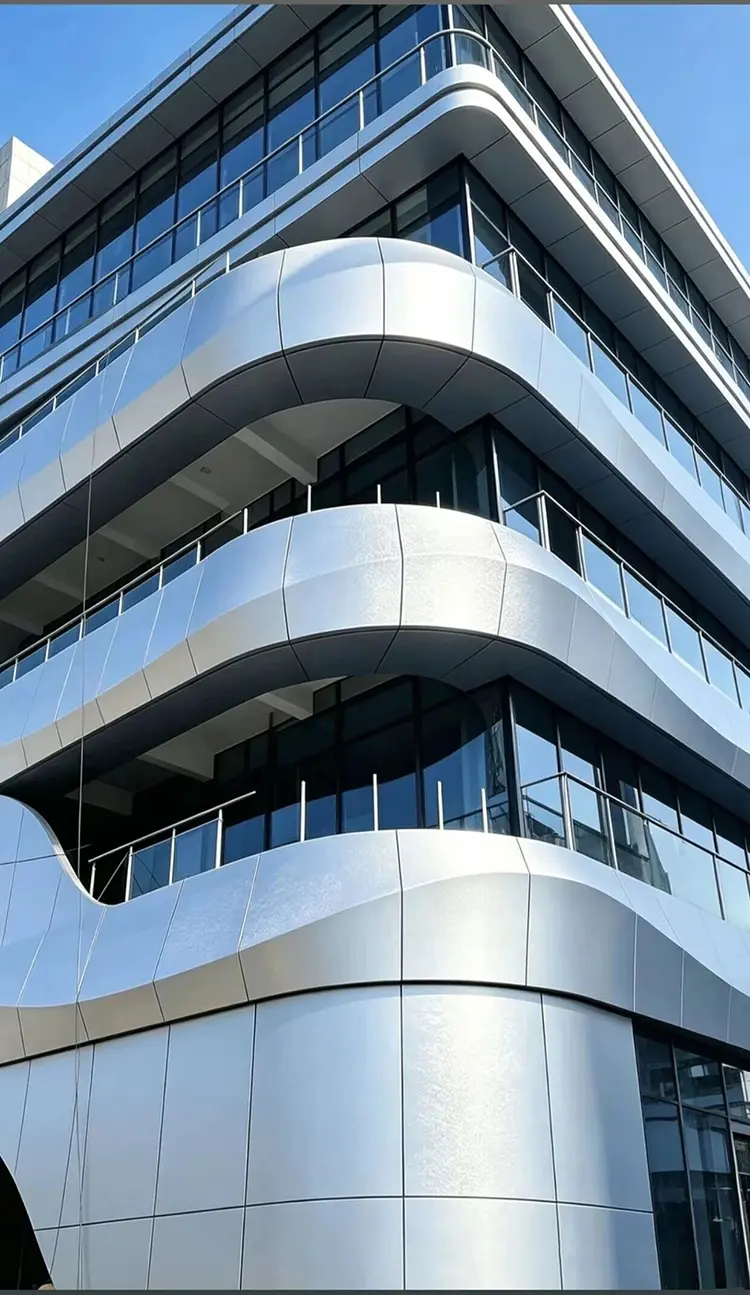 Aluminum Wall Panel Facades: The Ultimate Blend of Aesthetics and Functionality Curved aluminum wall panel facade on modern commercial building exterior