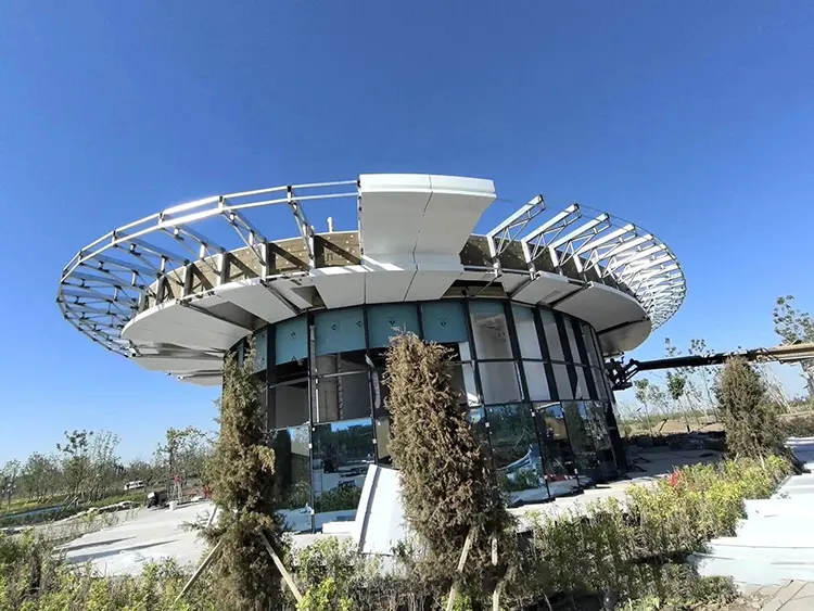White aluminum soffit panels partly installed beneath a circular canopy with exposed framing
