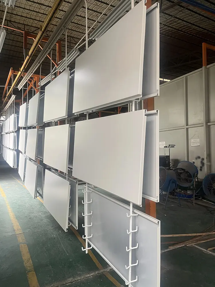 Custom Aluminum Column Covers: Sizes, Joints and Buying Guide White formed aluminum panels with folded edge returns suspended in the Likton workshop