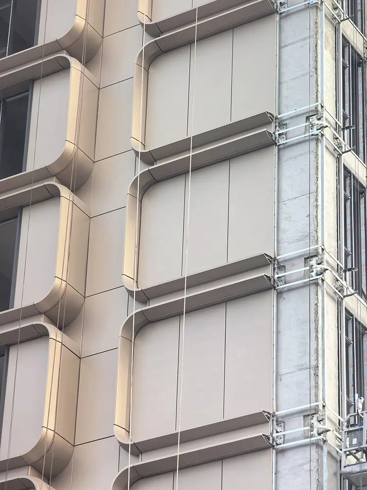 Custom Aluminum Column Covers: Sizes, Joints and Buying Guide Horizontal and vertical joints in champagne-colored facade-integrated aluminum enclosures