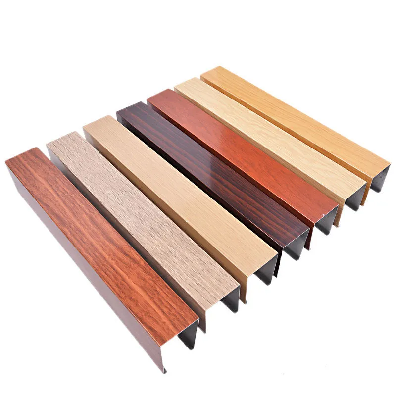 Aluminum Baffle Ceiling Cost: How Spacing and Accessories Change the Quote Wood-grain aluminum baffle samples with visible open profile ends