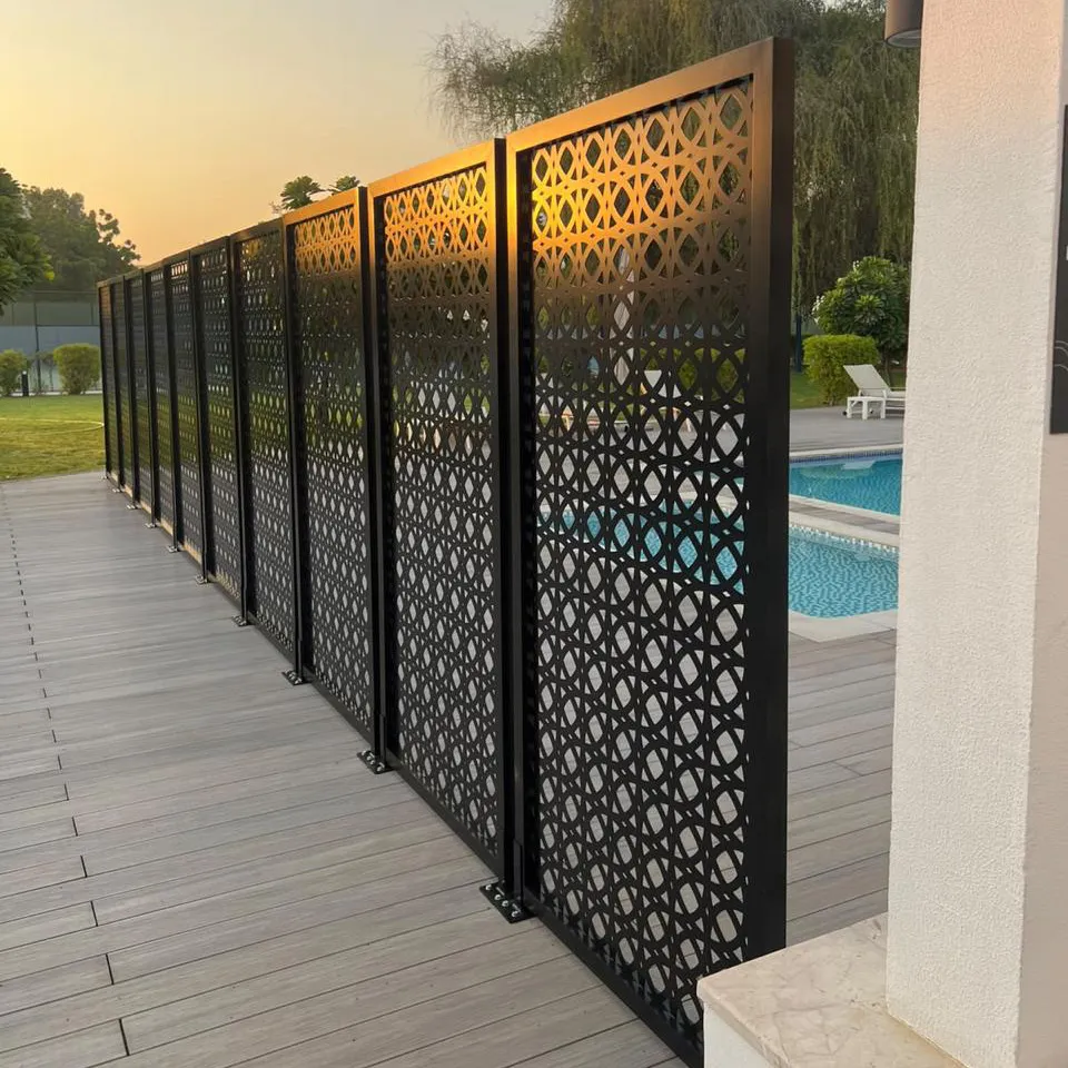 Laser-cut aluminum screen panels with decorative pattern by a poolside deck