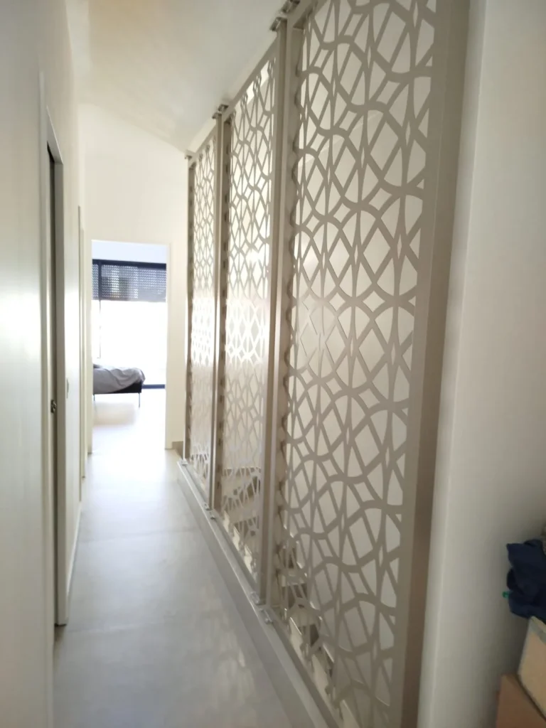 Laser-Cut Sliding Screens for Apartment Corridor